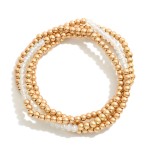 Set of Four Worn Gold Tone Beaded Stretch Bracelets Featuring Faceted Bead Focal

- Approximately 2.5" D