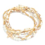 Set of Six Seed Bead and Metal Tone Bead Stretch Bracelets Featuring Dainty Metal Tone Beaded Cross Charm
- Approximately 2.5" D