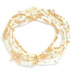 Set of Six Seed Bead and Metal Tone Bead Stretch Bracelets Featuring Dainty Metal Tone Beaded Cross Charm
- Approximately 2.5" D