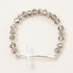 Faceted Bead Beaded Stretch Bracelet Featuring Hammered Metal East West Cross

- Approximately 2.5" D