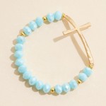 Faceted Bead Beaded Stretch Bracelet Featuring Hammered Metal East West Cross

- Approximately 2.5" D