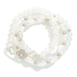 Set Of Three Beaded Bracelet Featuring Faceted Beads, Pearlescent Star, Metal Tone Beads And Clover Charms 

-Approximately 2.25" D