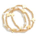 Set Of Three Metal Tone Beaded Stretch Bracelets Featuring Pearls & Plus Crosses 

- Approximately 2" D