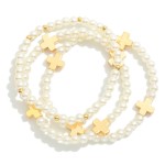 Set Of Three Metal Tone Beaded Stretch Bracelets Featuring Pearls & Plus Crosses 

- Approximately 2" D