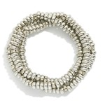 Set Of Three Metal Tone Disk Bead Stretch Bracelets Featuring Rhinestone Details 

- Approximately 2.5" D 

