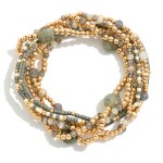 Set Of Seven Beaded Stretch Bracelets Featuring Metal Tone , Stone, & Seed Beads

- Approximately 3" D
