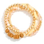 Set Of Four Beaded Stretch Bracelets Featuring Stone Beads And Gold Tones 

- Approximately 2.75 "D 