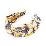 Floral Headband With Top Knot Detail 

-  One Size Fits Most 
- 50% Plastic / 50% Polyester 
