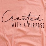 Wholesale salmon Bella Canvas brand Created Purpose script screen printed boutiq