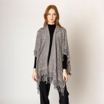 Solid Color Knit Ruana Wrap With Diamond Pattern Eyelets.

- One Size Fits Most (0-14)
- 100% Acrylic