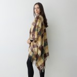 Striped Herringbone Ruana Wrap With Tassel Detail.

- One Size Fits Most (0-14)
- 100% Acrylic