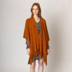 Solid Color Knit Ruana Wrap With Tassel Hem.

- One Size Fits Most
- 100% Acrylic