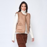 Faux Suede Vest With Front Pocket And Faux Fur Lining 

- One Size Fits Most 
- Hook Eye Closure 
- 100% Polyester 
