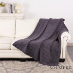 Solmere Blanket – Cable Knit Monochromatic Blanket

Wrap yourself in pure indulgence. Our Solmere Blanket combines a fashion-forward design with an irresistibly soft hand-feel that’s as beautiful as it is cozy.

- Luxuriously Soft – Crafted from ultra-plush, high-quality fibers you’ll want to snuggle into all season long.

- Perfectly Sized – Approximately 50” W x 60” L, perfect for draping over your sofa, bed, or yourself.

- Premium Craftsmanship – 100% polyester for lasting softness, warmth, and easy care.

- Thoughtful Packaging – Each blanket is tied with a branded ribbon in a bow and includes two cards: one featuring the SOLMERE brand and another showcasing a high-quality image of the blanket’s print. Individually packaged

Once you touch it, you’ll understand why SOLMERE blankets are love at first feel.

