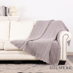 Solmere Blanket – Cable Knit Monochromatic Blanket

Wrap yourself in pure indulgence. Our Solmere Blanket combines a fashion-forward design with an irresistibly soft hand-feel that’s as beautiful as it is cozy.

- Luxuriously Soft – Crafted from ultra-plush, high-quality fibers you’ll want to snuggle into all season long.

- Perfectly Sized – Approximately 50” W x 60” L, perfect for draping over your sofa, bed, or yourself.

- Premium Craftsmanship – 100% polyester for lasting softness, warmth, and easy care.

- Thoughtful Packaging – Each blanket is tied with a branded ribbon in a bow and includes two cards: one featuring the SOLMERE brand and another showcasing a high-quality image of the blanket’s print. Individually packaged

Once you touch it, you’ll understand why SOLMERE blankets are love at first feel.

