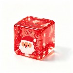Christmas glitter cube squishy with a shimmering jelly body and a printed holiday character set inside the block. Light passes right through it, so it sparkles on a windowsill or under a tree. The soft cube squeezes flat and slowly rebounds, making it a fidget and a decoration at once. A festive impulse buy for holiday displays and gift bags.