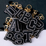 Wholesale black initial pillow keychain bag charm rhinestone details tassel acce