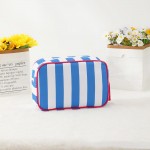 Striped Nylon Padded Pouch With Tassels 

- Full Zip Closure 
- Lined Body 
- Approximately  9.25" L X 6.25" T X 2.5" D