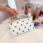 Wholesale polka dot cosmetic bag curved zip opening soft structured body keeps