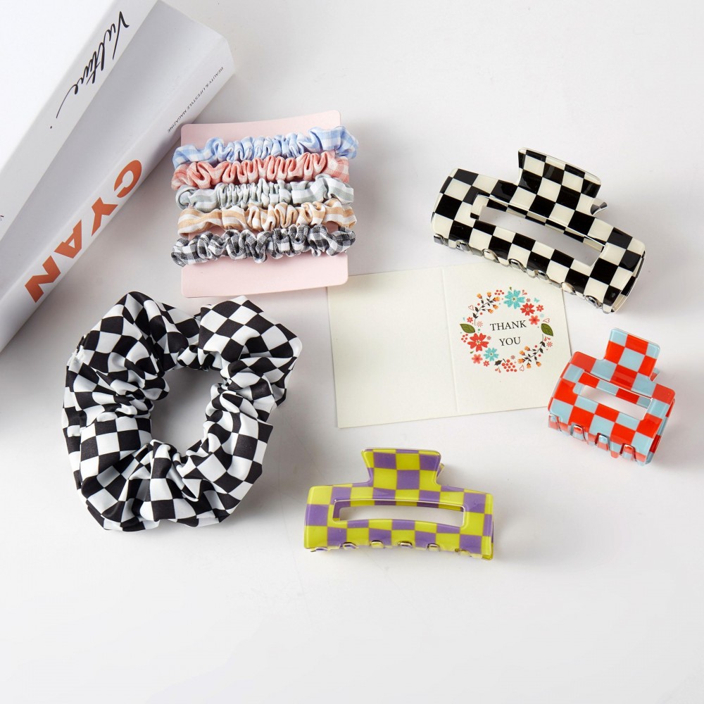 Checker Hair Accessory Box Box Includes: - 3 Claw Hair Clips - 1 Large Scrunchy With Rhinestone Details - 5 Mini Scrunchies view 2