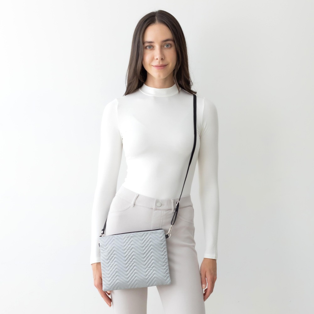 Reflective Chevron Stitch Cross Body Handbag With Detachable Leather Wristlet and Adjustable Strap. - One Inner Pocket With Zipper Closure - Approximately 10” W x 8” T - Strap Drop Approximately 13” - 27” L - 100% Polyester view 4