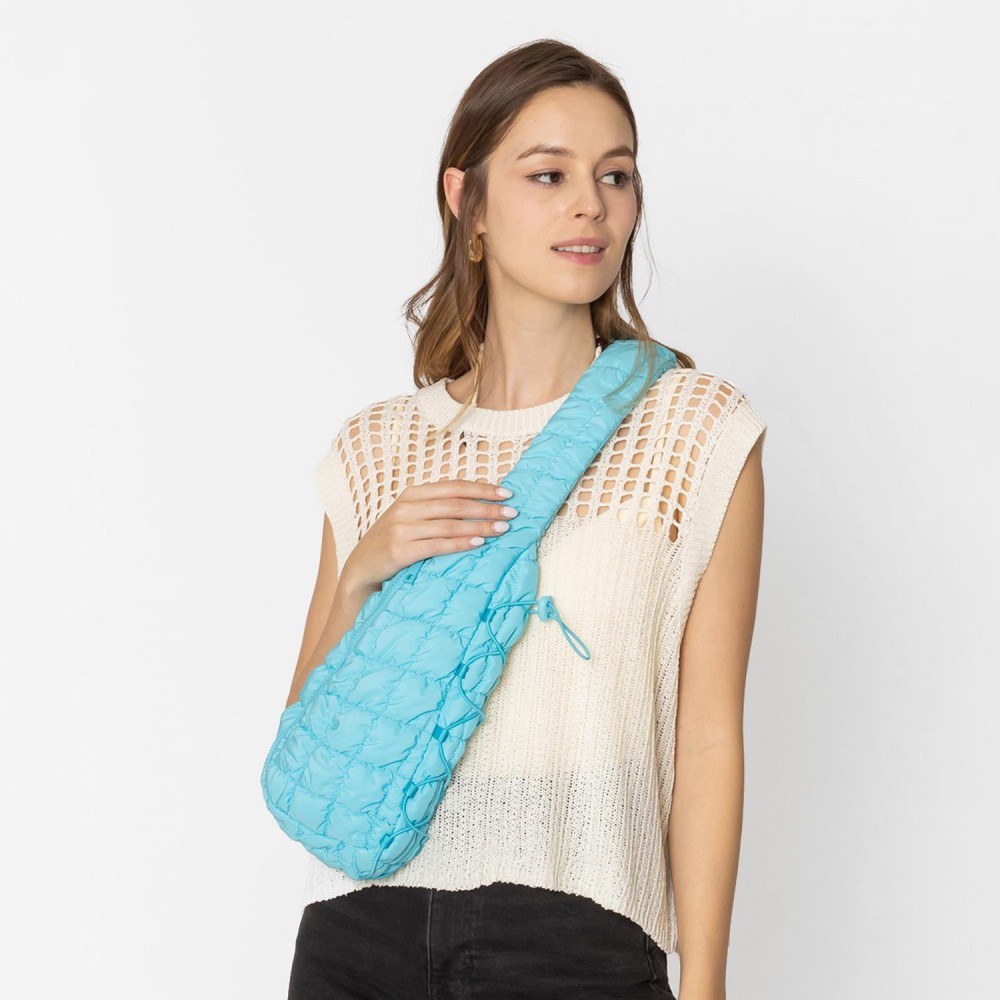 Do Everything In Love Quilted Puffer Sling Bag With Adjustable Cross Body Strap & Drawstring Detail - Full Zip Closure - Fully Lined - Inside Zip Pocket & Open Pocket - Nylon Strap With Buckle - Approximately 14"H x 8"W x 4"D - 100% Polyester view 2