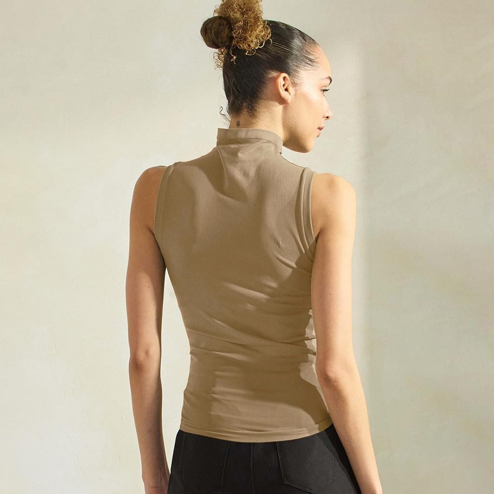 Women's Mock Neck Seamless Sleeveless Tank •Seamless Mock Neck •Self Fabric Armhole Band •Bra-friendly Tank • Imported •92% Nylon, 8% Spandex view 4