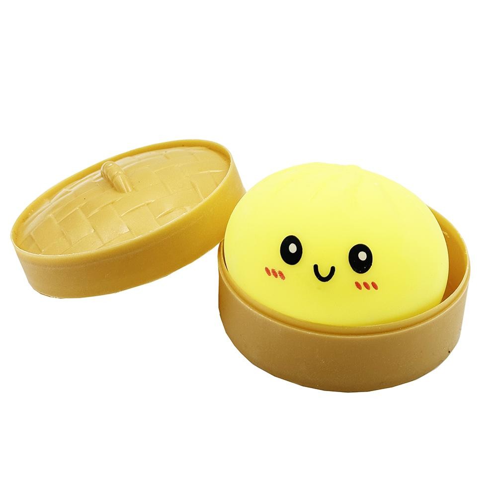 Dumpling Squishy Toy Cute novelty squishy toy designed as a smiling dumpling in a bamboo-style steamer. - Ages 3+ - Approximately 5.5" L view 2