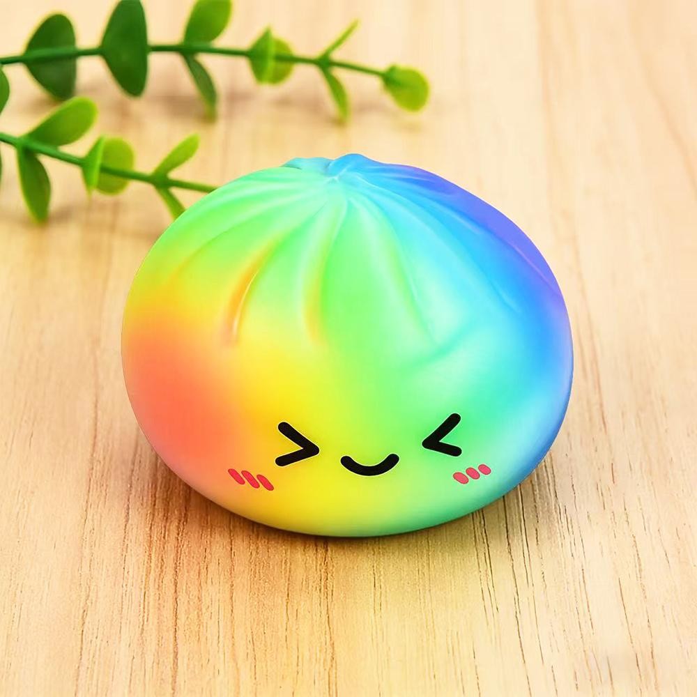 Rainbow Dumpling Squishy Toy Bright novelty squishy toy featuring a toast-inspired design with colorful accents. - Ages 3+ - Approximately 3" L view 2