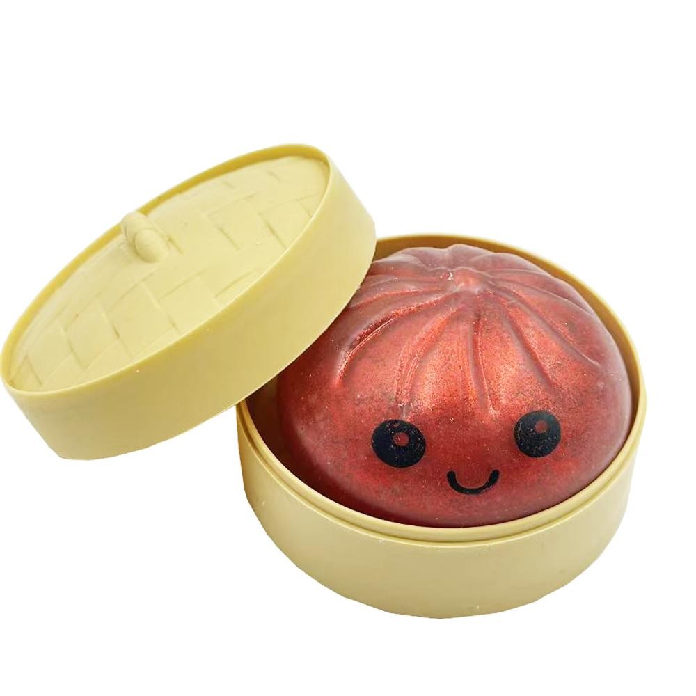 Dumpling Squishy Toy Cute novelty squishy toy designed as a smiling dumpling in a bamboo-style steamer. Perfect for gifts, impulse buys, and food-themed novelty displays. - Ages 3+ - Approximately 3" L view 2
