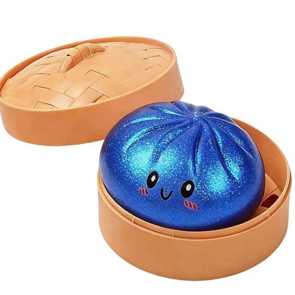 Dumpling Squishy Toy Cute novelty squishy toy designed as a smiling dumpling in a bamboo-style steamer. Perfect for gifts, impulse buys, and food-themed novelty displays. - Ages 3+ - Approximately 3" L view 2