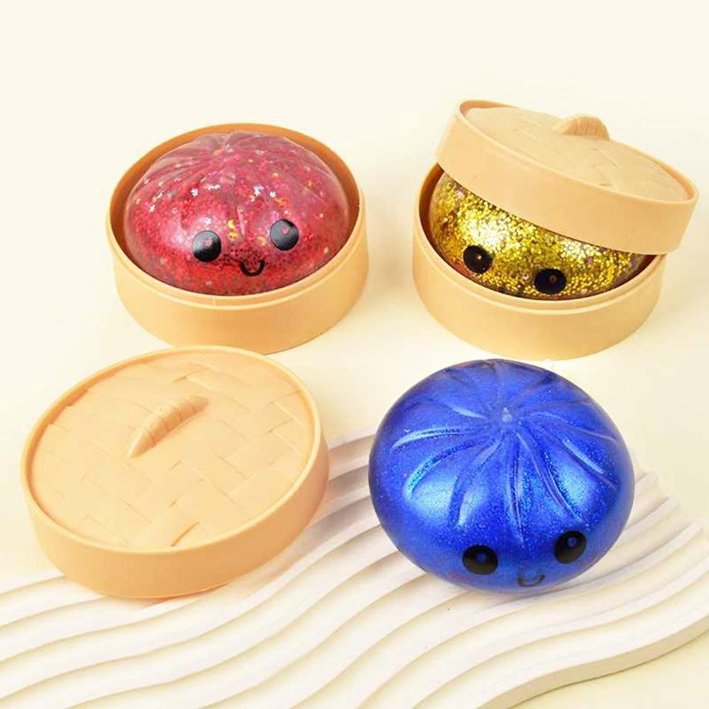 Dumpling Squishy Toy Cute novelty squishy toy designed as a smiling dumpling in a bamboo-style steamer. Perfect for gifts, impulse buys, and food-themed novelty displays. - Ages 3+ - Approximately 3" L view 4