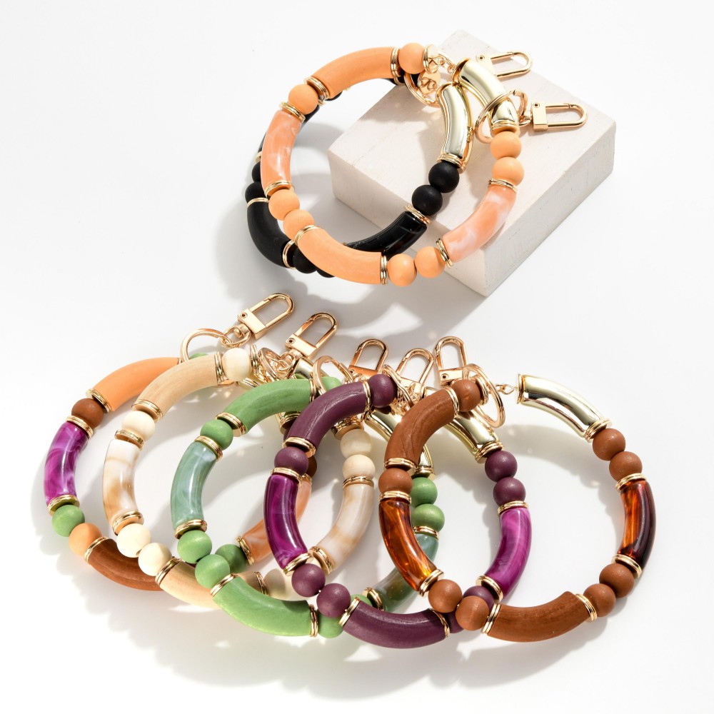 Acrylic Tube Keyring Featuring Wooden Beads and Gold Accents - Approximately 3" Diameter view 4