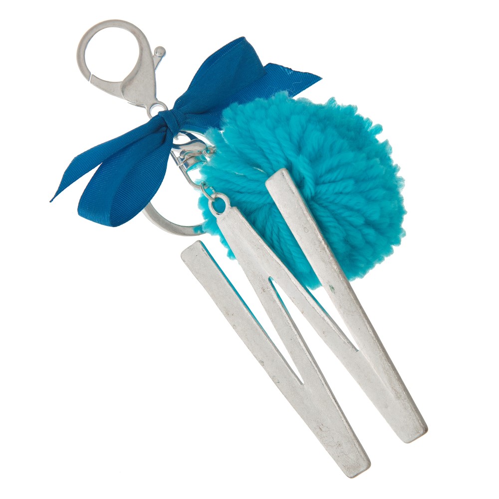 Silver tone key chain or bag charm with a block 'W' initial pendant and blue pom pom. Approximately 5.5" in length. view 2