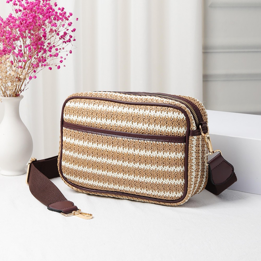 Straw Cross Body Handbag Featuring Leather Trim With Detachable Nylon Strap - Zip Closure - One Outer Pocket - Two Inner Pockets: One Zip - One Open - Approximately 10" L x 6.5" T x 2.5" W - Strap Drop 15" - 24" L view 2