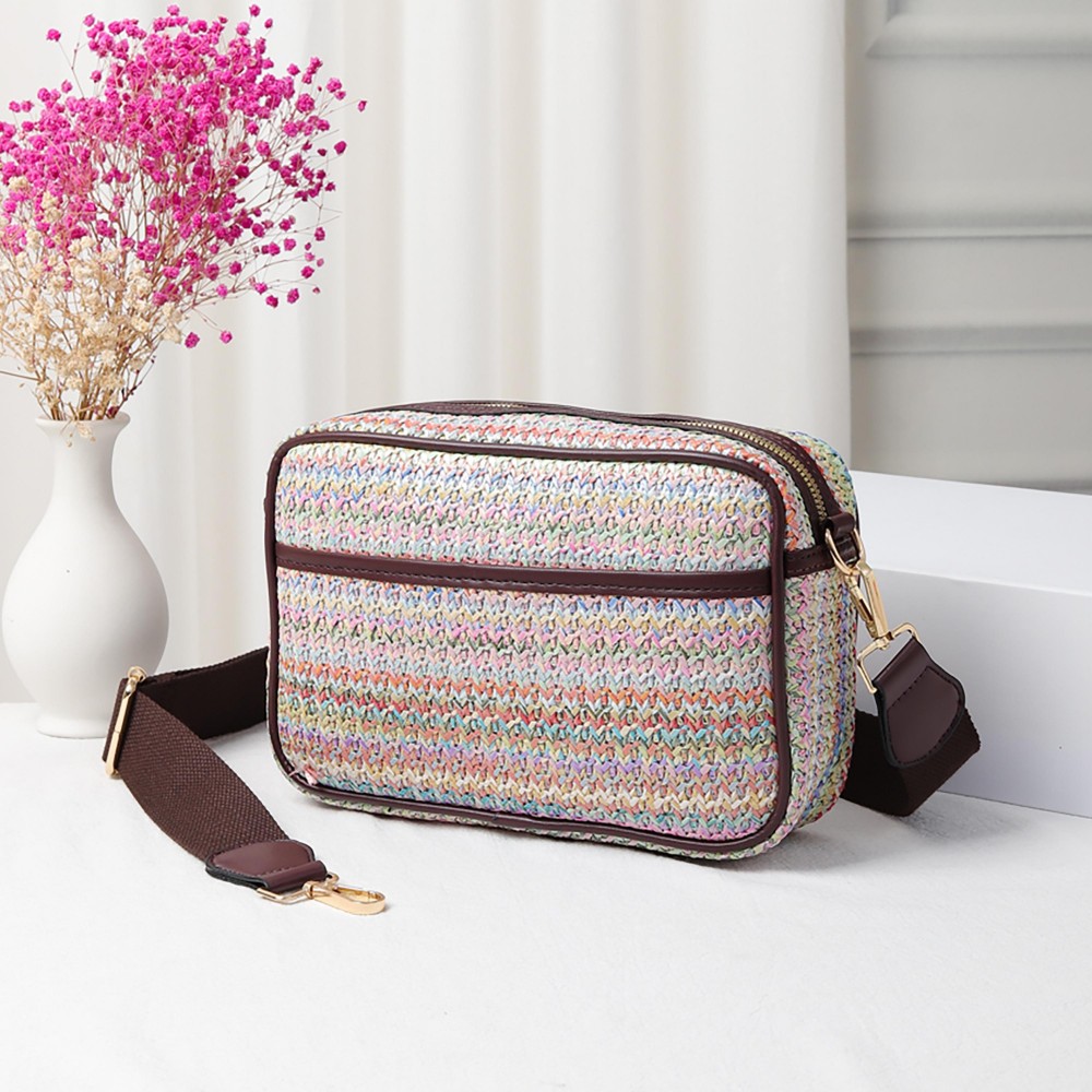 Straw Cross Body Handbag Featuring Leather Trim With Detachable Nylon Strap - Zip Closure - One Outer Pocket - Two Inner Pockets: One Zip - One Open - Approximately 10" L x 6.5" T x 2.5" W - Strap Drop 15" - 24" L view 2