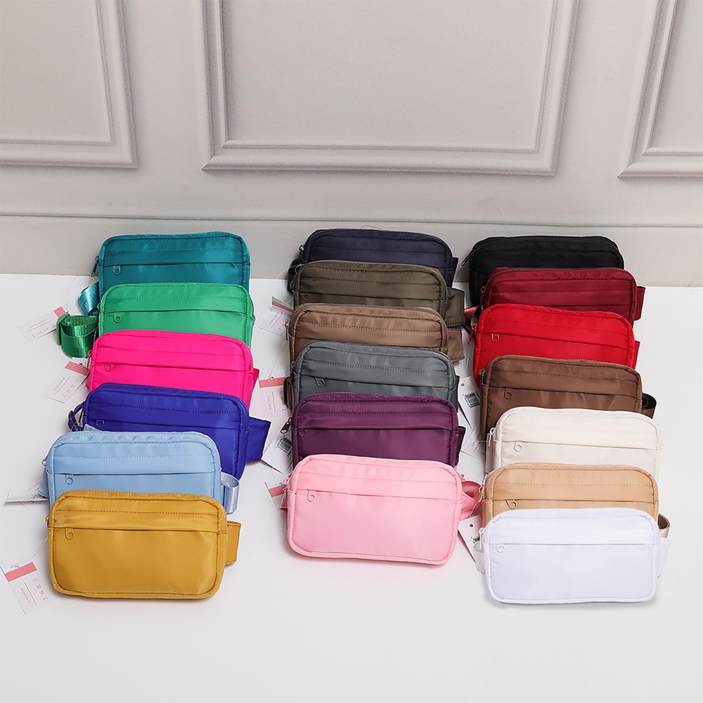 Nylon Belt Bag With Covered Front Zipper - Full Zipper Closure - Zip Pocket on Back - Adjustable Strap - Approximately 9"W X 5.5" T X 1" D view 4