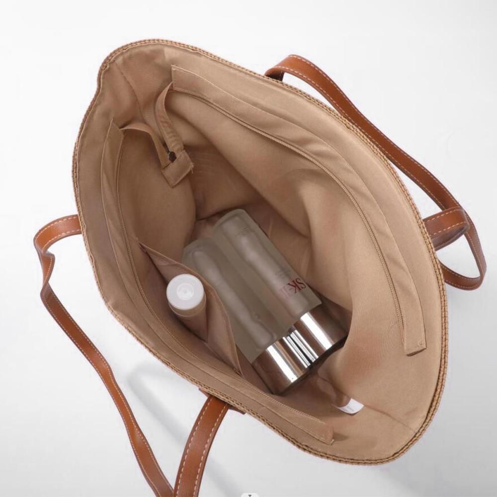 Woven Straw Tote Bag With Faux Leather Handles - Lined Body - Full Zipper Closure - Open Internal Pocket - Approximately 10" W X 11" T X 6" D - Strap Drop 12" L - 100% Paper view 6
