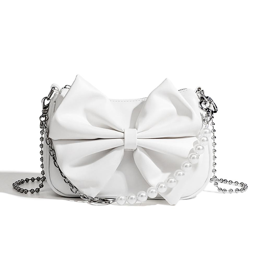 Vegan Leather Bow Cross Body Bag - Full Zipper Closure - Lined Interior With Zipper Pocket - Removable Ball Chain Strap (22"L) - Removable Pearl/Chain Clutch Strap - Approximately 8.5"W X 5.5"T X 2.5"D view 2