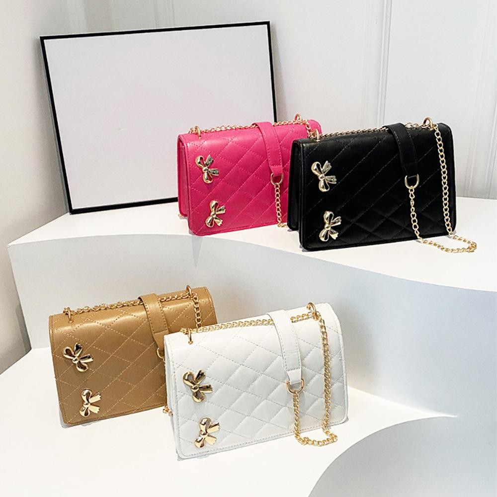 Vegan Leather Quilted Cross Body Tote Bag Featuring Metal Bow Details - Magnetic Snap Closure - Chain Link Strap Drop 10-18" L - Approximately 6" T X 9" L X 3" D view 4