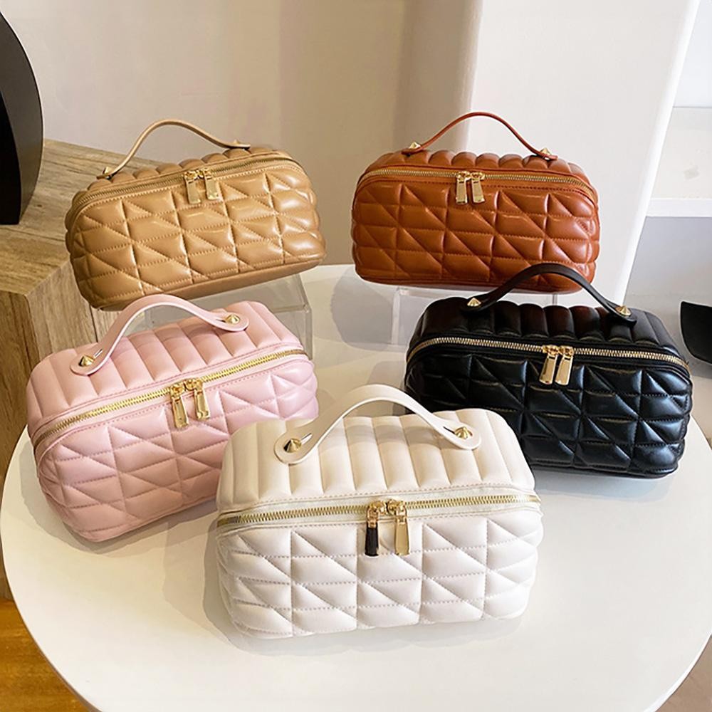 Quilted Vegan Leather Travel Makeup Bag - Full Zipper Closure - 3 Internal Side Pockets & 1 Center Zipper Brush Pocket - Center Lays Flat When Bag Is Opened - Approximately 9” L X 5” T X 4” D view 4