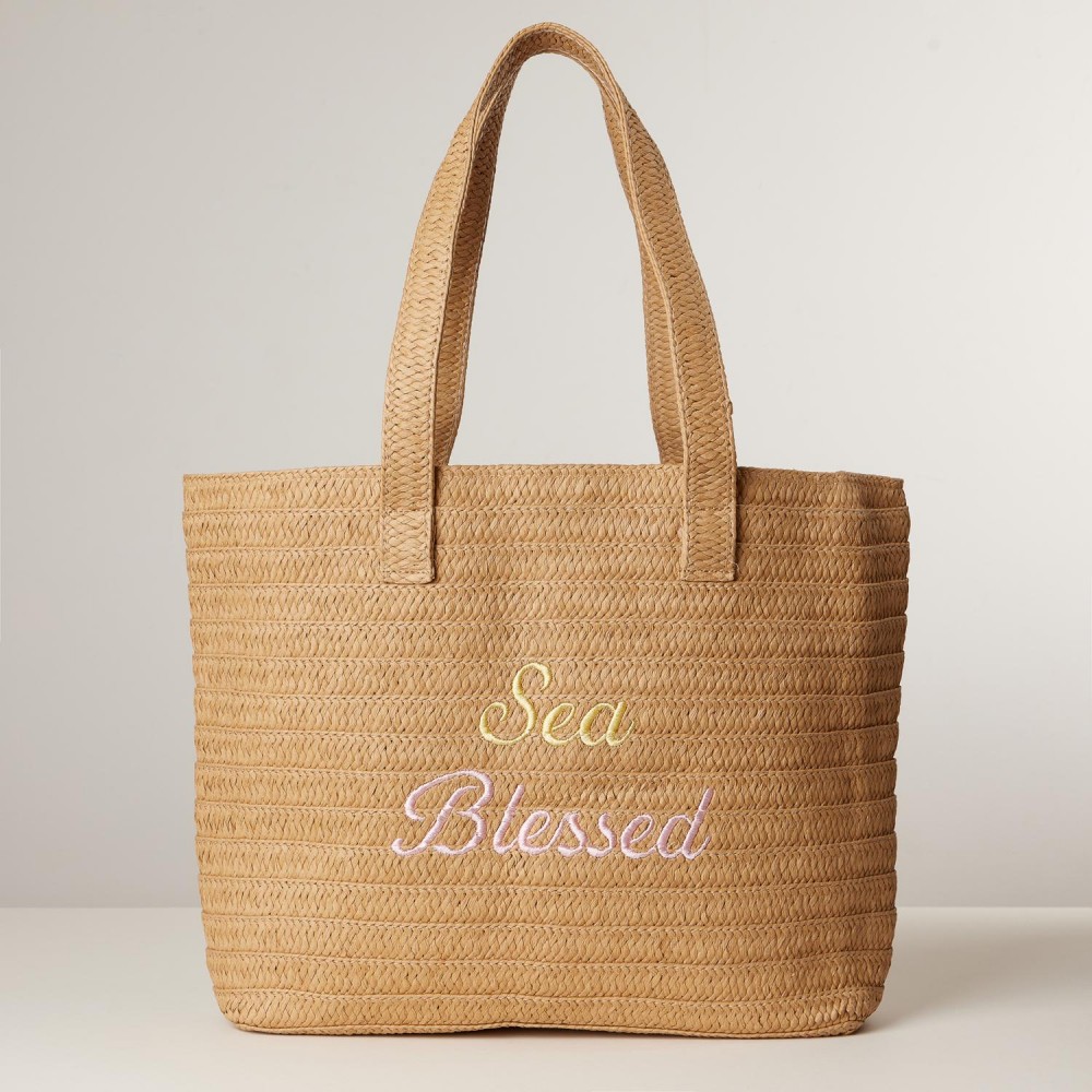 "Sea Blessed" Embroidered Woven Raffia Tote Bag With Tassel Detail - Lined Body - Snap Closure - 1 Inner Open Pocket - Removable Tassel Detail - Approximately 20" L X 14" T X 4.5" D - 100% Papyrus Raffia view 2