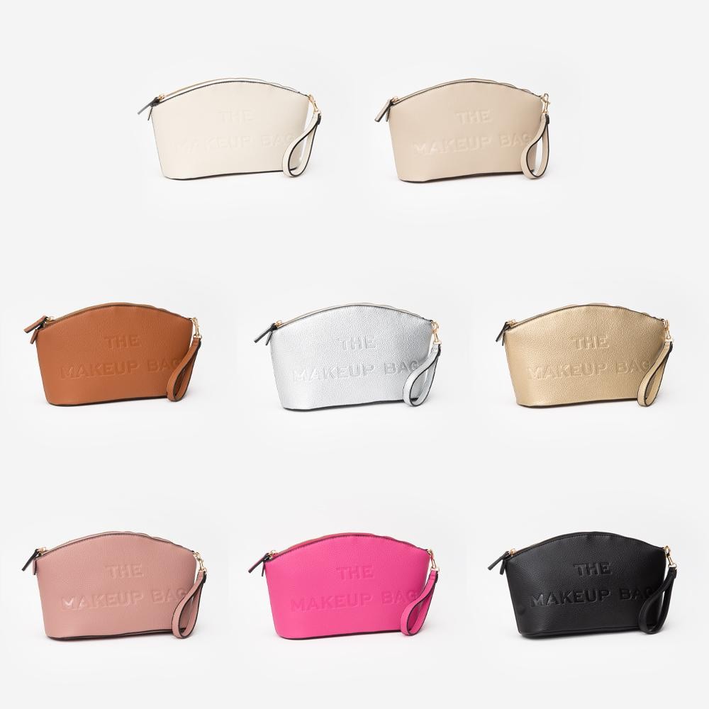 Vegan Leather Makeup Bag With Embossed " THE MAKEUP BAG" Detail - Full Zip Closure - Removeable Wristlet - 1 Internal Zip Pocket - Approximately 10.5" L X 6.5" T X 3" D view 4