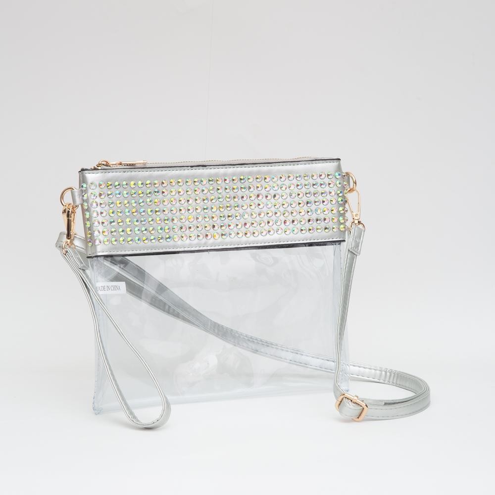 Clear Wristlet With Vegan Leather Trim & Rhinestone Stud Details - Zip Closure - Removeable Wristlet 20"-38" L - Removable Vegan Leather Crossbody Strap - Approximately 9" L X 8" T view 2